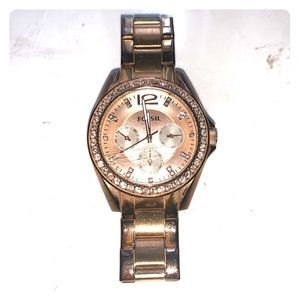 Rose gold fossil watch with crystal lined face.